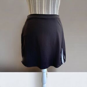 K Swiss sports skirt, size L, black and white, no shorts, pockets,Good condition
